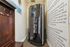 Room with standup tanning bed