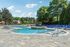 Pool with lounge chair and grill