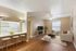Living room, kitchen and bedroom in the background