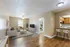 Living room, kitchen and bedroom in the background