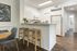 Kitchen with quartz countertops and dining area