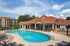 Pool with clubhouse and apartment buildings