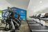 Modern fitness center with treadmills and ellipticals, featuring motivational wall decor.