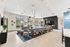 Inviting community lounge with modern seating, stylish decor, and natural light through large windows.