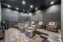 Modern home theater room with plush leather seating, stylish gray walls, and ambient lighting for an ultimate cinematic experience.