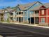 The Station at Alafaya, exerior, parking, yellow, blue, and red buildings, balconies