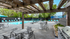 Poolside grill area with tables