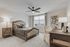 Bright and inviting bedroom with elegant furnishings, plush bedding, and modern d&eacute;cor, perfect for relaxation and comfort.