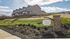 Charming Preston Park townhomes with lush landscaping and scenic hillside views, perfect for tranquil living.