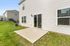 Inviting backyard space with a sleek patio area, perfect for outdoor gatherings and relaxation.