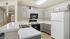 Modern kitchen with sleek gray cabinets, spacious countertops, and updated appliances for a stylish and functional living space.