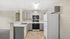 Modern kitchen with sleek cabinetry, stylish countertops, and efficient appliances, ideal for culinary enthusiasts.