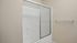 Modern bathroom with a sleek glass shower door and elegant wall texture, offering a spa-like retreat.