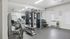 Modern fitness center with state-of-the-art gym equipment, sleek interior design, and motivational decor.