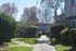Charming apartment surrounded by lush greenery and vibrant trees, offering a peaceful and inviting atmosphere.