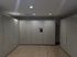 Modern package locker room with sleek gray lockers and advanced digital technology, ensuring secure and efficient parcel delivery.