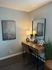 Chic home office nook featuring a rustic wooden desk, stylish decor, and elegant lighting, perfect for productivity and inspiration.