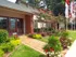 Vineyard Place: Red Brick Exterior, Large Entrance Door, Golden Brick Walkways, Beautiful Landscape.