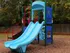 Outdoor Playground Structure: Double slide, climbers, playhouse, fenced.