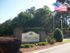 Hunters Run brick pillar sign board at community entrance.