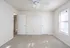 Inviting bedroom with soft carpet flooring, window, and ceiling fan for comfort.