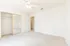 Bright and airy bedroom with neutral carpet, large mirrored closet, and ceiling fan.