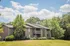 Inviting apartment complex surrounded by lush greenery and scenic landscaping.