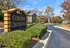 Inviting entrance to Corder Crossing with manicured shrubbery and welcoming sign.