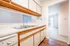 Inviting kitchen space featuring modern cabinetry and a bright opening to the living area.