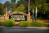 Inviting entrance sign for Corder Crossing surrounded by lush greenery.