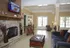 Leasing Office - stone fireplace, comfortable seating, and elegant decor.