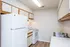 Bright kitchen with white appliances, wooden cabinets, and ample counter space.