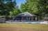 Inviting swimming pool area surrounded by lush greenery and comfortable lounge chairs.