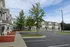 Charming townhouse community with beautifully manicured lawns, ample parking, and sunny outdoor spaces.