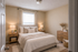 Inviting bedroom with cozy bedding, ambient lighting, and elegant wooden furniture creating a warm and serene ambiance.