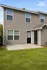 Charming two-story home with modern siding and a welcoming front entry, surrounded by a lush green lawn.
