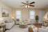 Inviting living room with cozy sofas, elegant decor, and warm lighting, perfect for relaxation and entertaining.