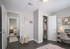 Charming bedroom with a cozy desk setup, inviting decor, and a convenient walk-in closet.