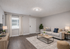 Bright and inviting living room with modern decor, comfortable sofa, and elegant lighting, perfect for relaxation and entertaining.