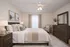 Elegant bedroom with a plush bed, stylish wooden furniture, and soft lighting creating a cozy and inviting atmosphere.