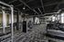 Modern fitness center with advanced gym equipment, featuring treadmills, weight machines, and sleek industrial design.