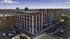Chic urban apartment building with modern architectural design, offering panoramic city views and a vibrant downtown location.