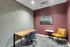 Chic home office with a contemporary desk, comfortable seating, and elegant wall art, creating a perfect work-from-home atmosphere.
