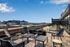 Chic rooftop terrace with stylish seating and expansive city views, perfect for relaxation and entertaining.