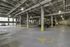 Spacious, well-lit underground parking garage with ample parking spots and sleek modern design.