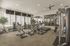 Apartments Near Provo, UT - Concord at Geneva - Fitness Center Equipped with Two Running Machines, Two Exercise Bikes, a Pair of Leg Workout Stations, Two Smith Racks, a Selection of Free Weights, and Four Flat-Screen TVs Overlooking the Play Area