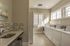 Laundry area showing sink, 4 washers, and 6 dryers