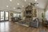 Activity Center sitting area with 2 couches, flat screen television, fireplace, and coffee table