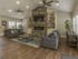 Activity Center sitting area with 2 couches, flat screen television, fireplace, and coffee table
