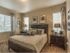 Master bedroom showing queen bed, 2 nightstands, and 3 windows